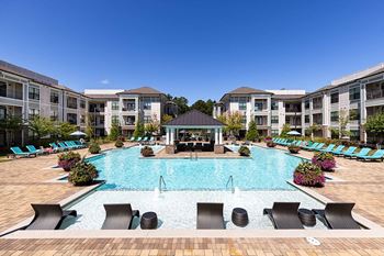 Two resort-style swimming pools with sun ledge